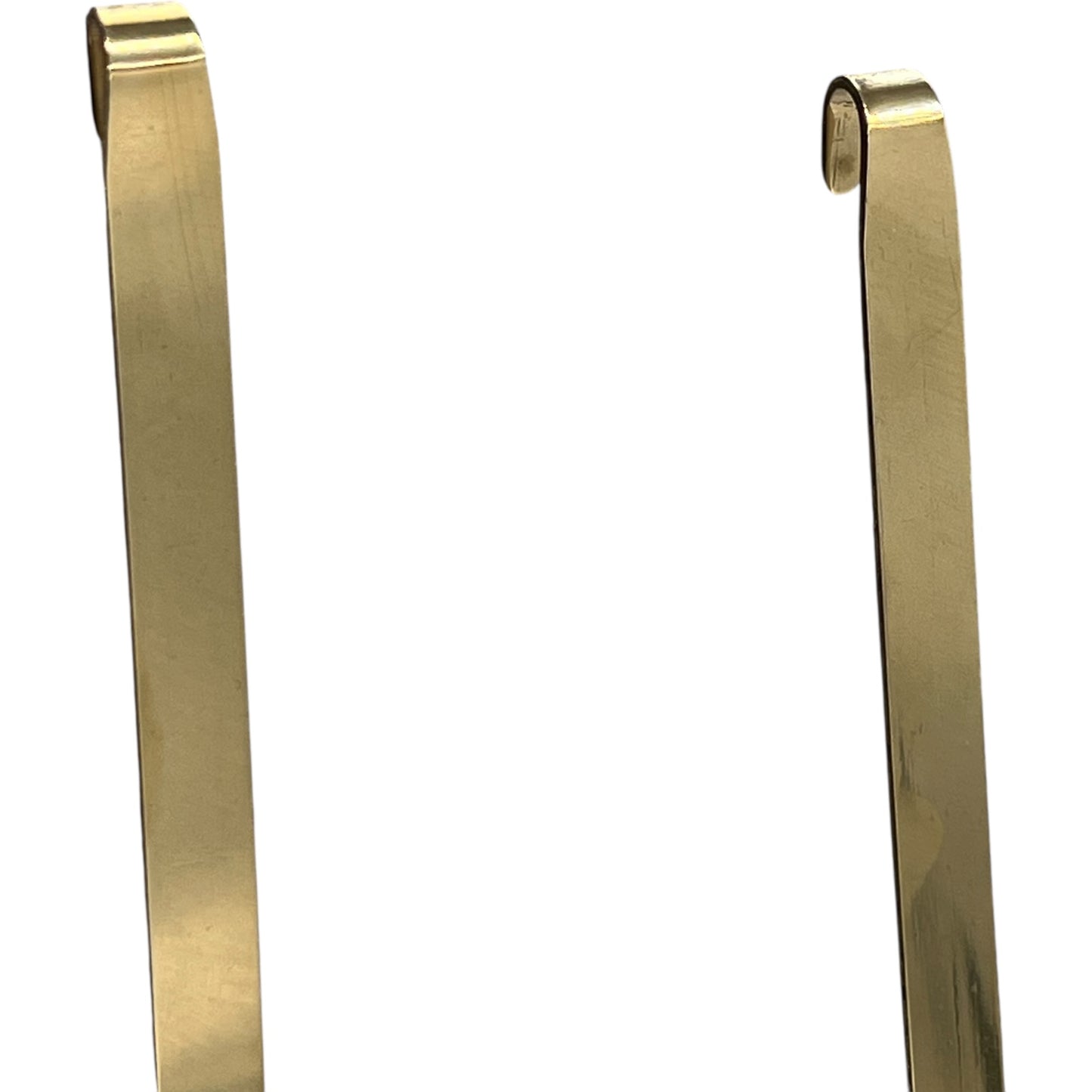 pair of brass handles on a white background