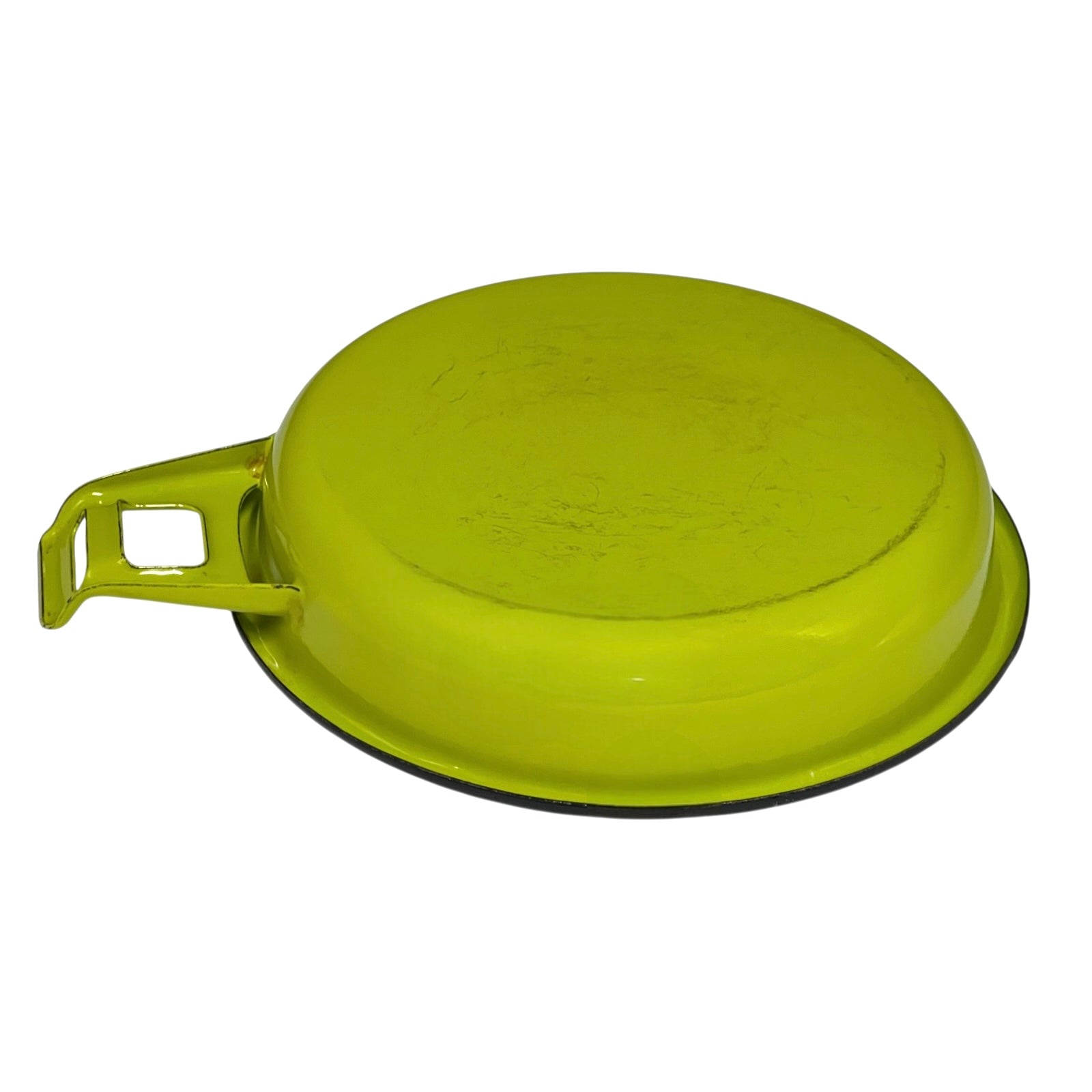 Green frying pan with a white interior on a white background