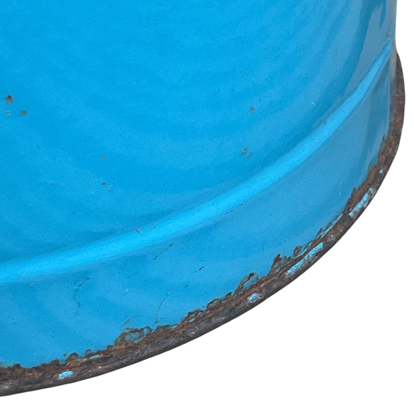 Close up of blue metal bucket with a wooden handle on a white background