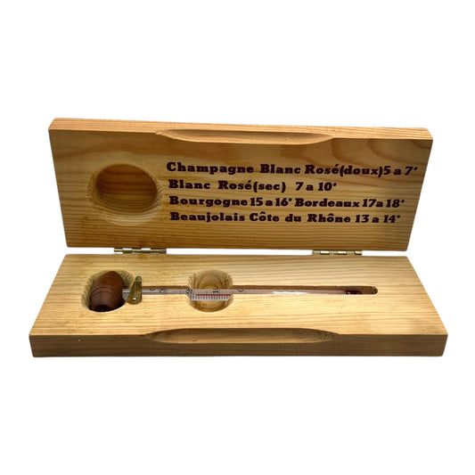 Wooden box with a wine thermometer and measurement labels on a white background