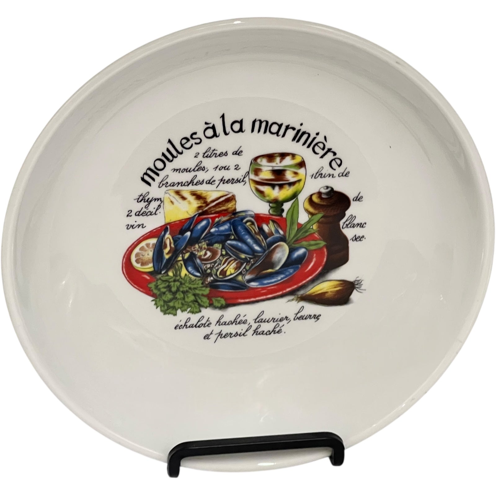 Ceramic plate with decorative design and text on a white background