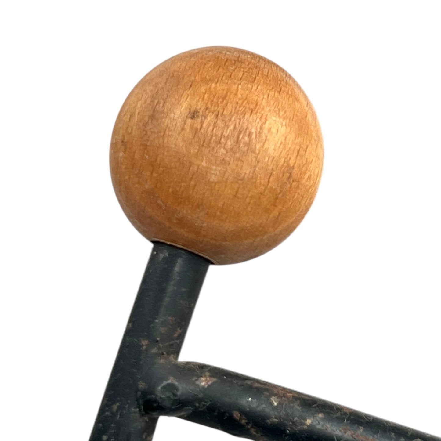 Close-up of a black metal stand on a white background
