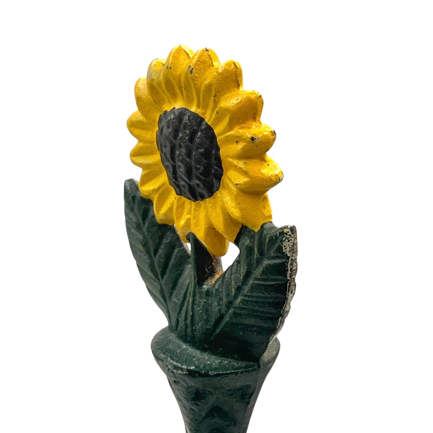 Close-up of a sunflower decoration on a kitchen paper towel stand on a white background