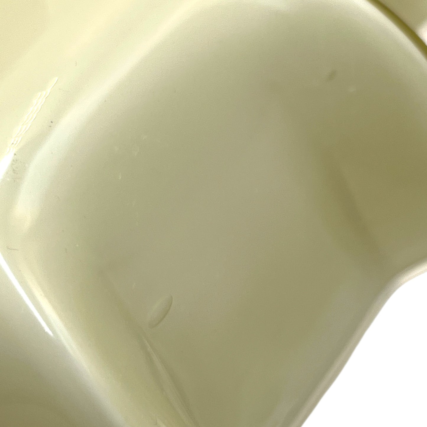 Close-up of a milk glass shade on a white background