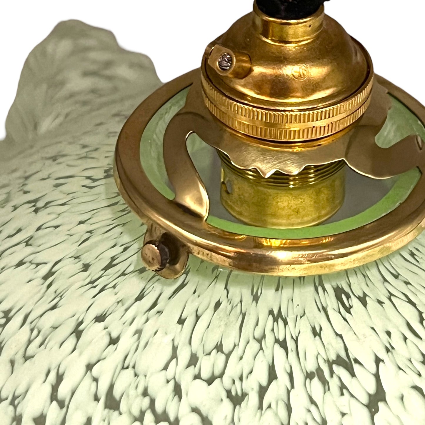 close up of light green milk glass pendant shade on a white background