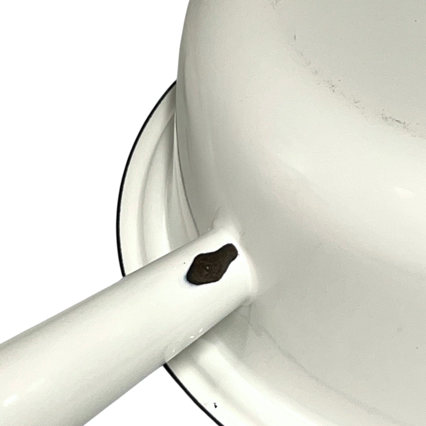 close up of White enamel saucepan handle inside on a white background