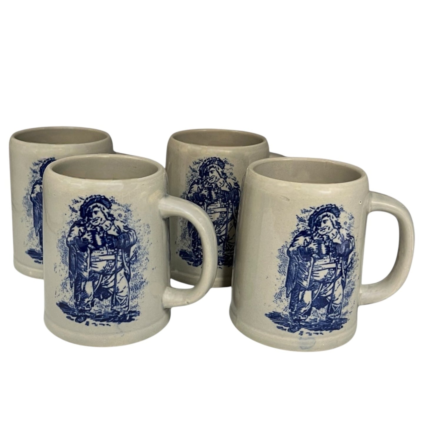 set of 4 grey ceramic German beer steins with a blue pattern on the front on a bar counter