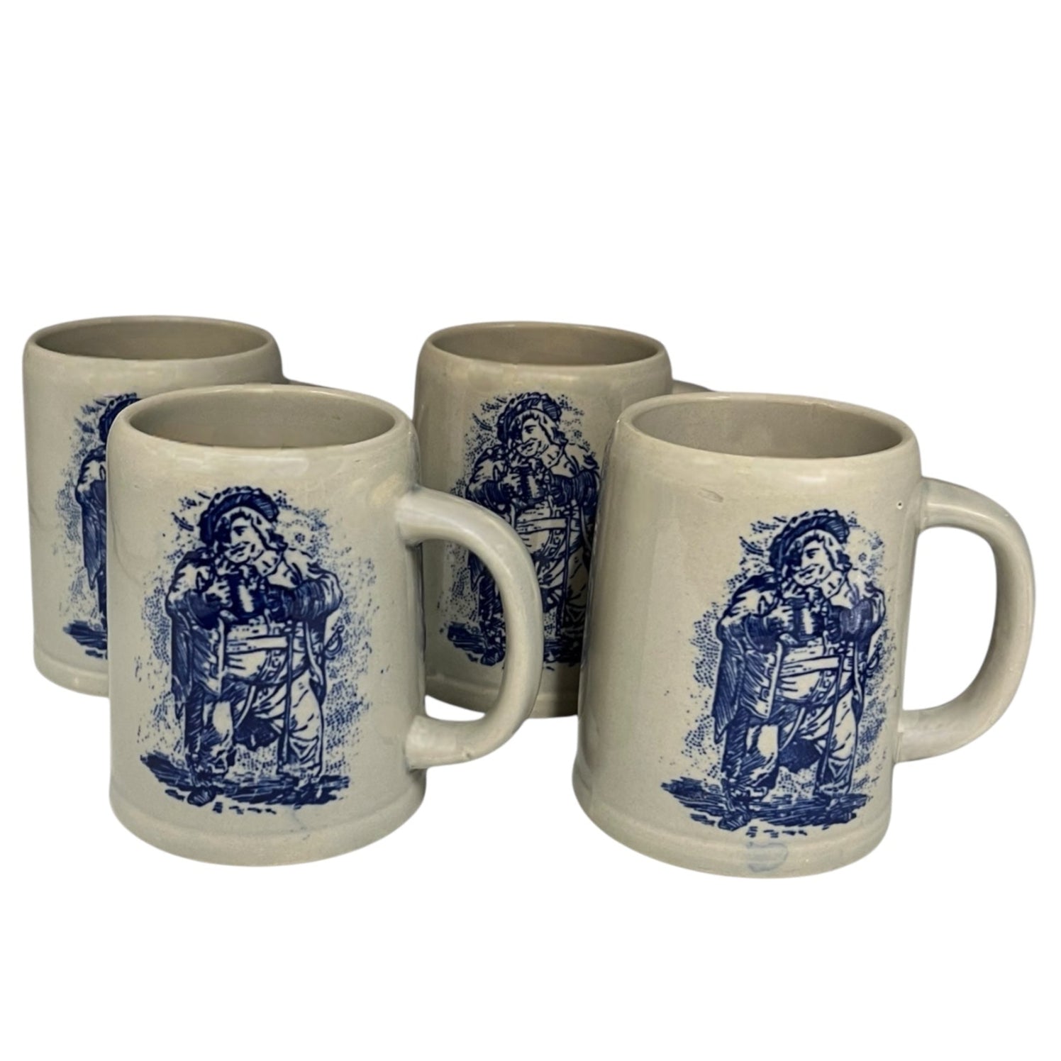 set of 4 grey ceramic German beer steins with a blue pattern on the front on a bar counter