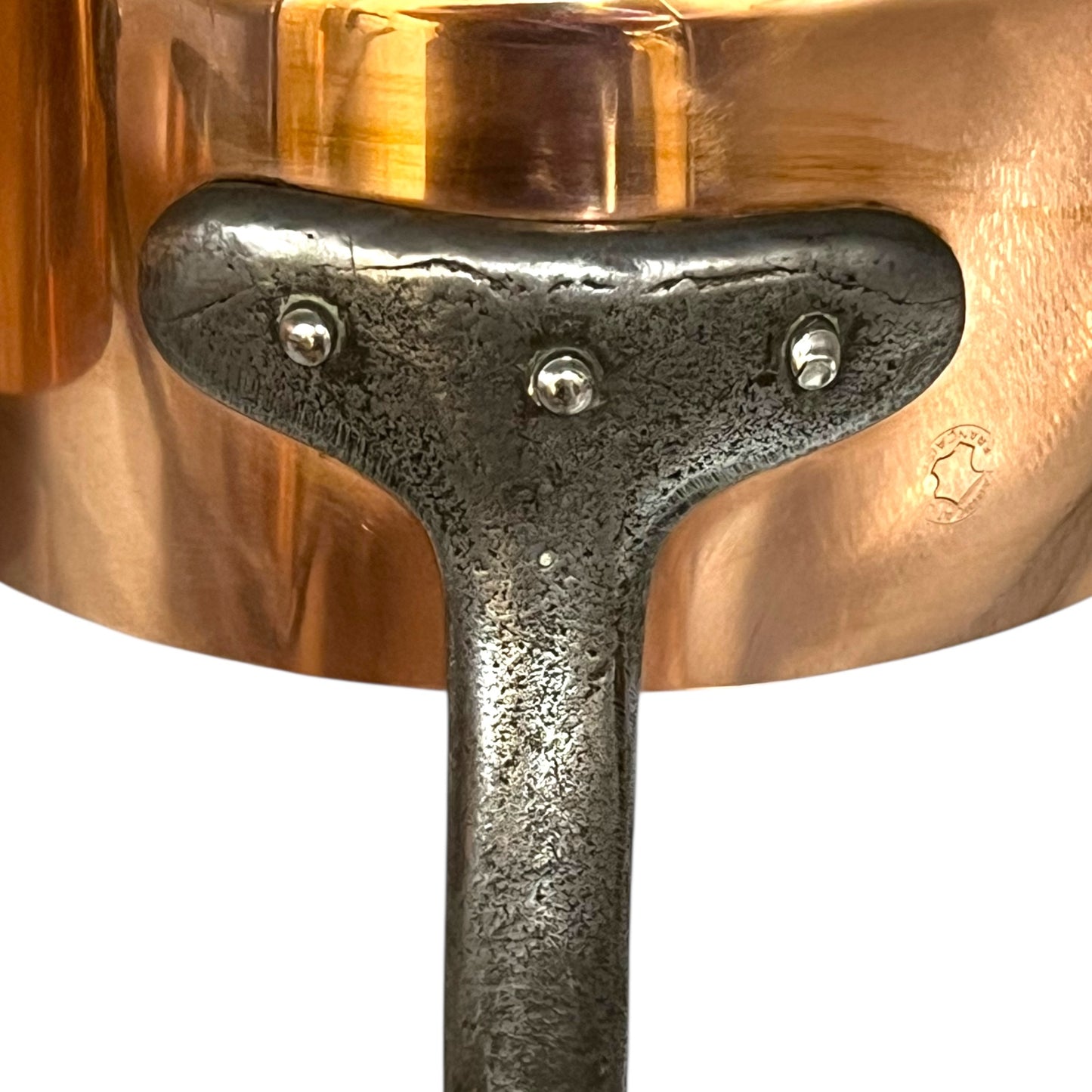 cast iron handle of copper pan