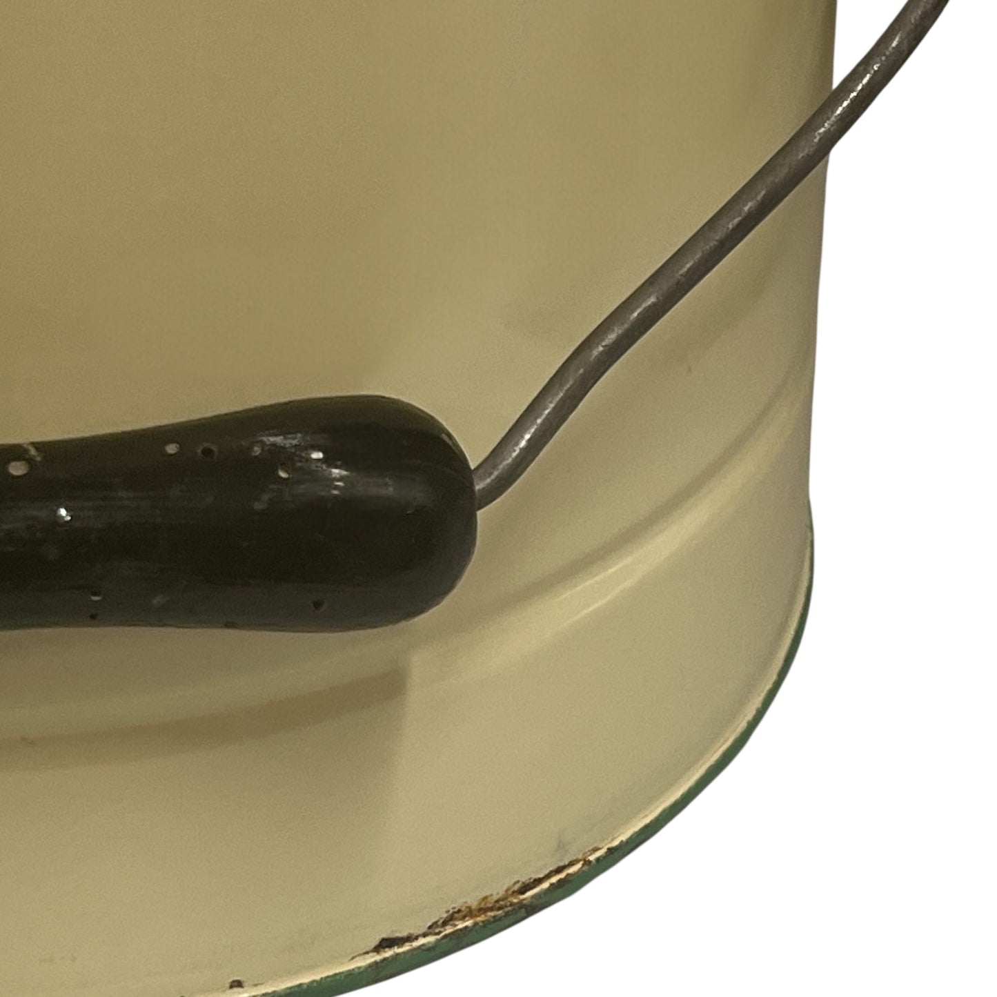 Close up of French vintage cream and green enamel bucket with a lid and handle on a white background