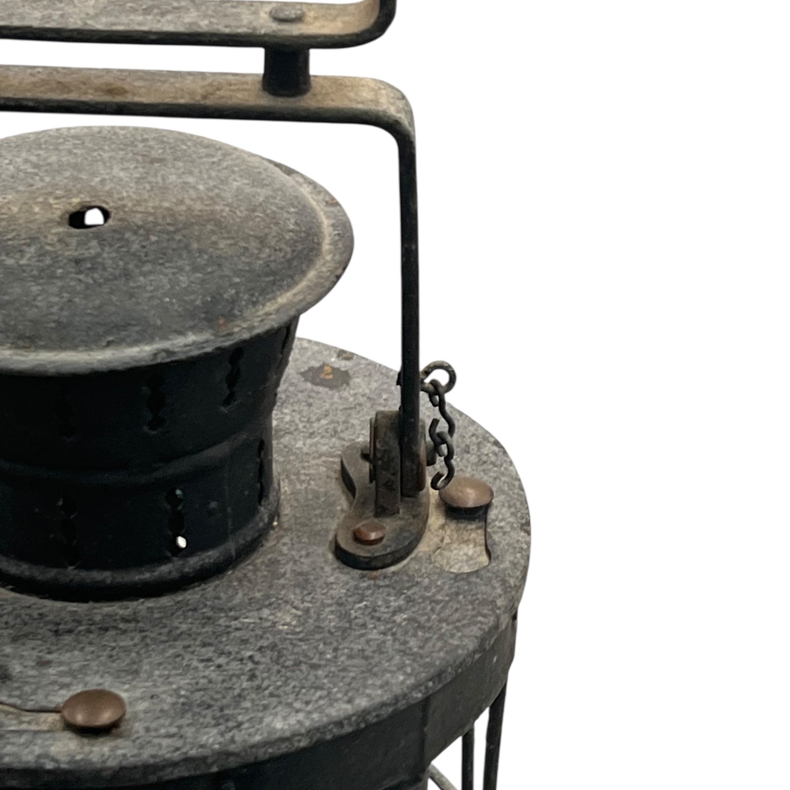 Vintage metal lamp with textured surface on a white background