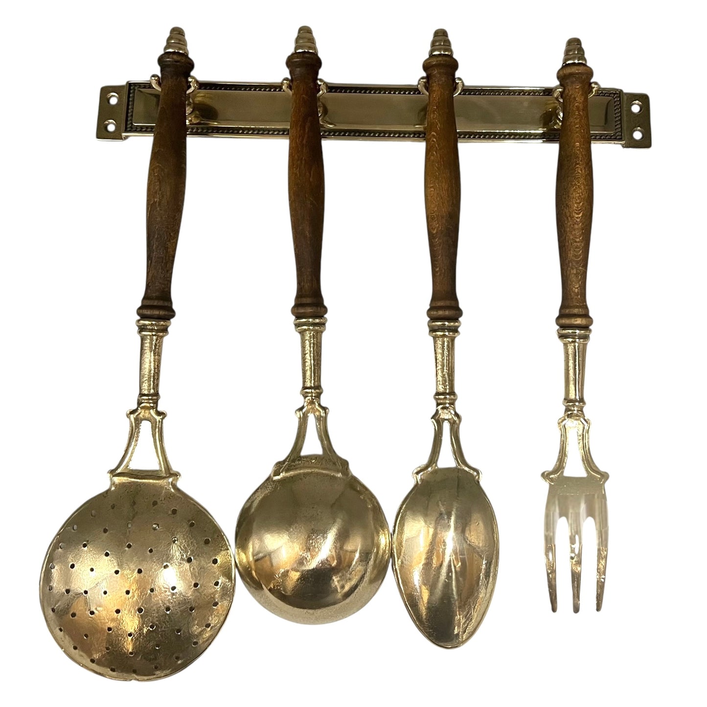 Set of four vintage-style spoons and a fork hanging on a metal rack with wooden handles.