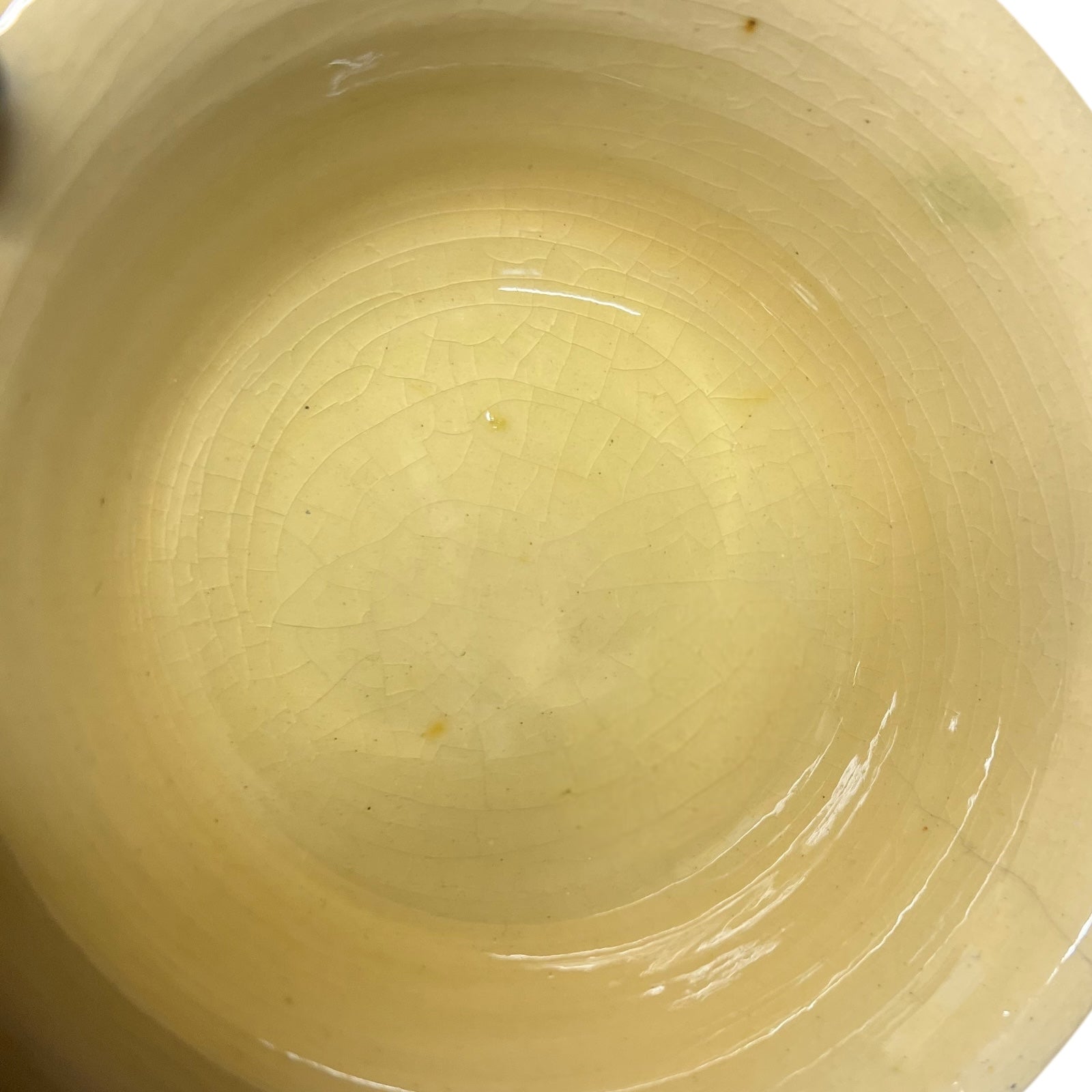 Close-up of a beige ceramic cup's interior