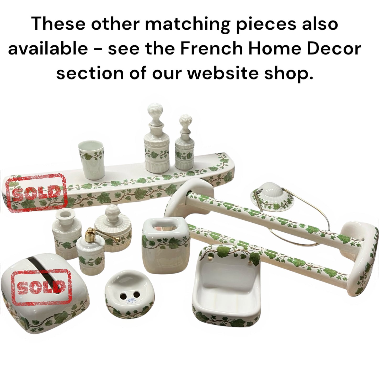 Set of porcelain bathroom accessories with ivy patterns on a white background, featuring 'SOLD' stamps and text directing to a website.