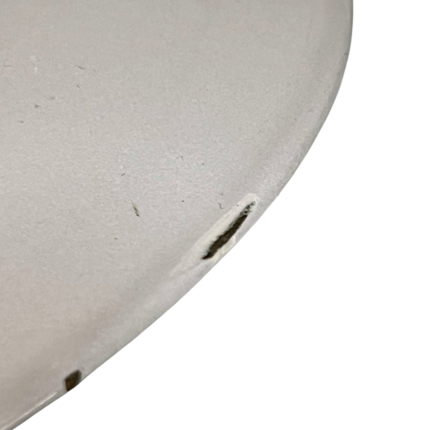 Close up of a Le Creuset pot on a white background
