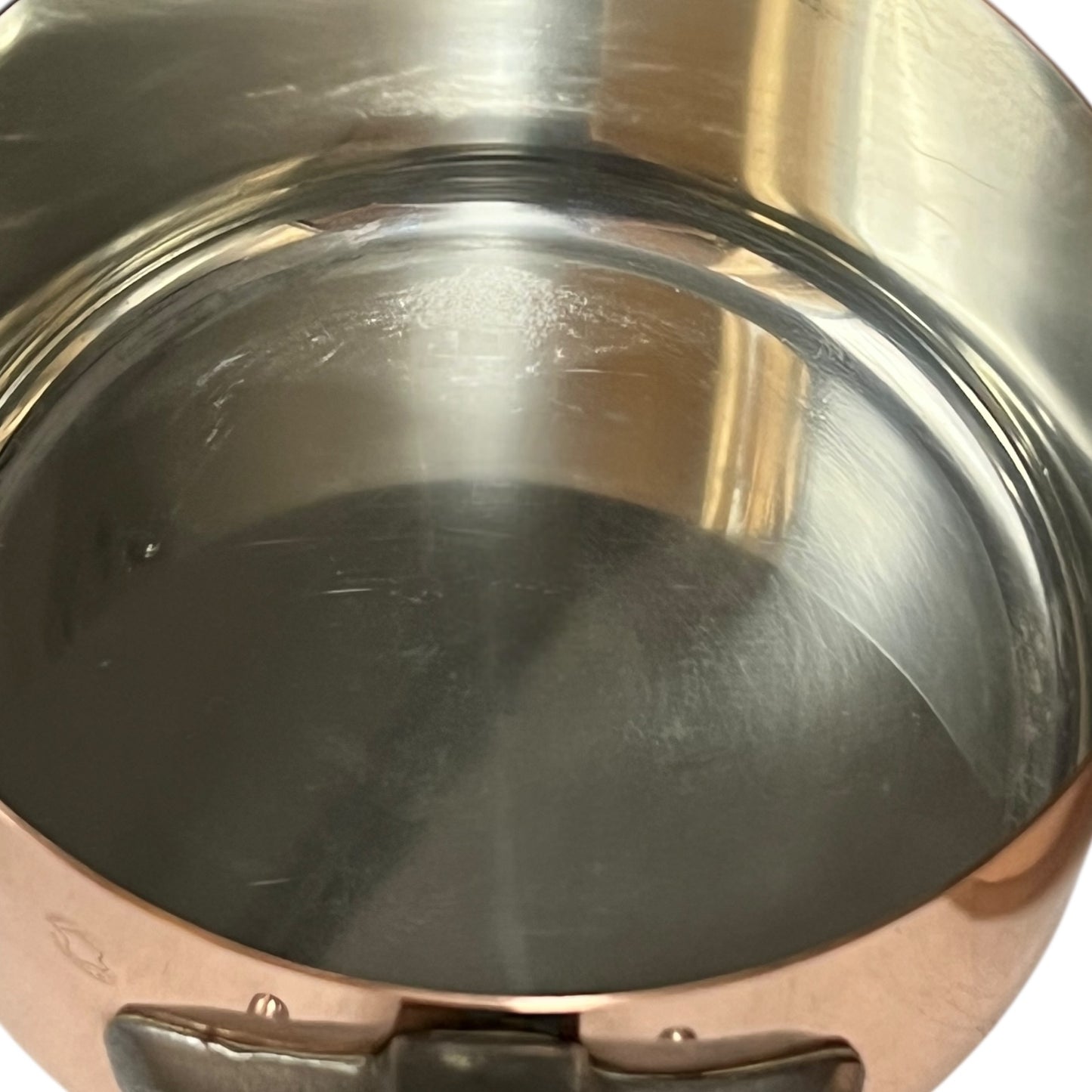 close up inside image of tin lined copper pan