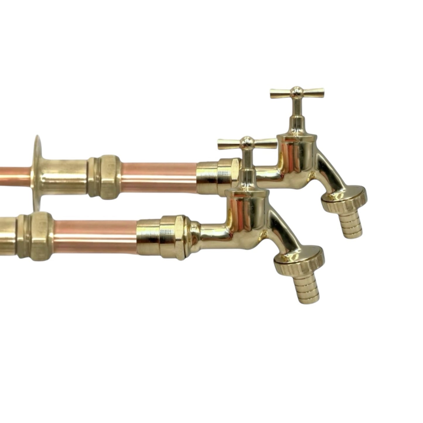 Pair of copper and brass wall taps with detachable nozzles on a white background