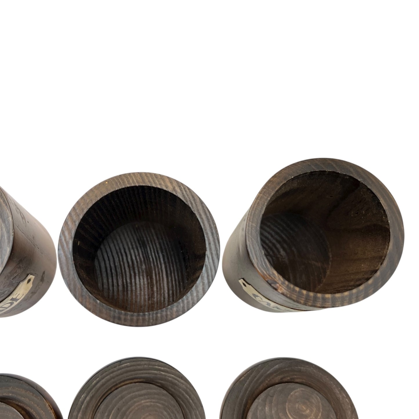 inside view of wooden spice jars with lids n a white background