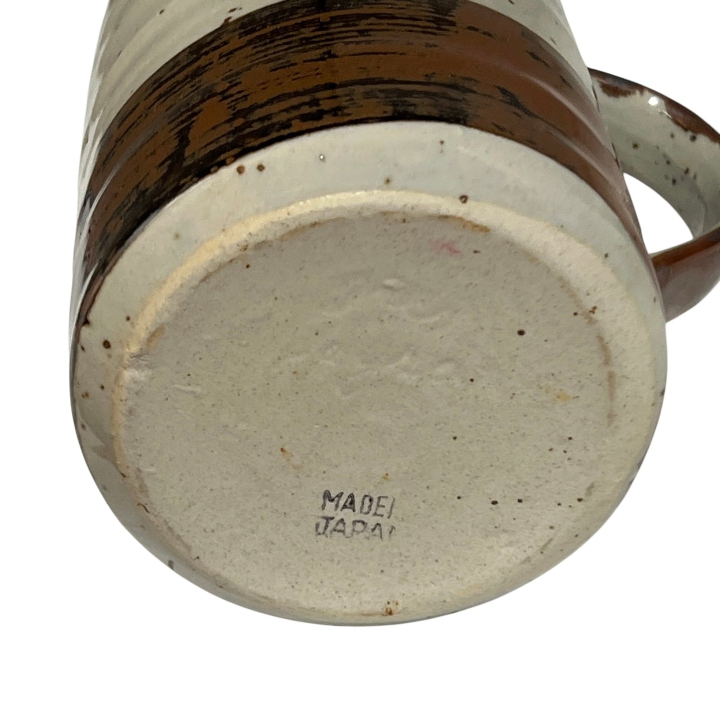 close up of ceramic glazed pitcher jug on a white background