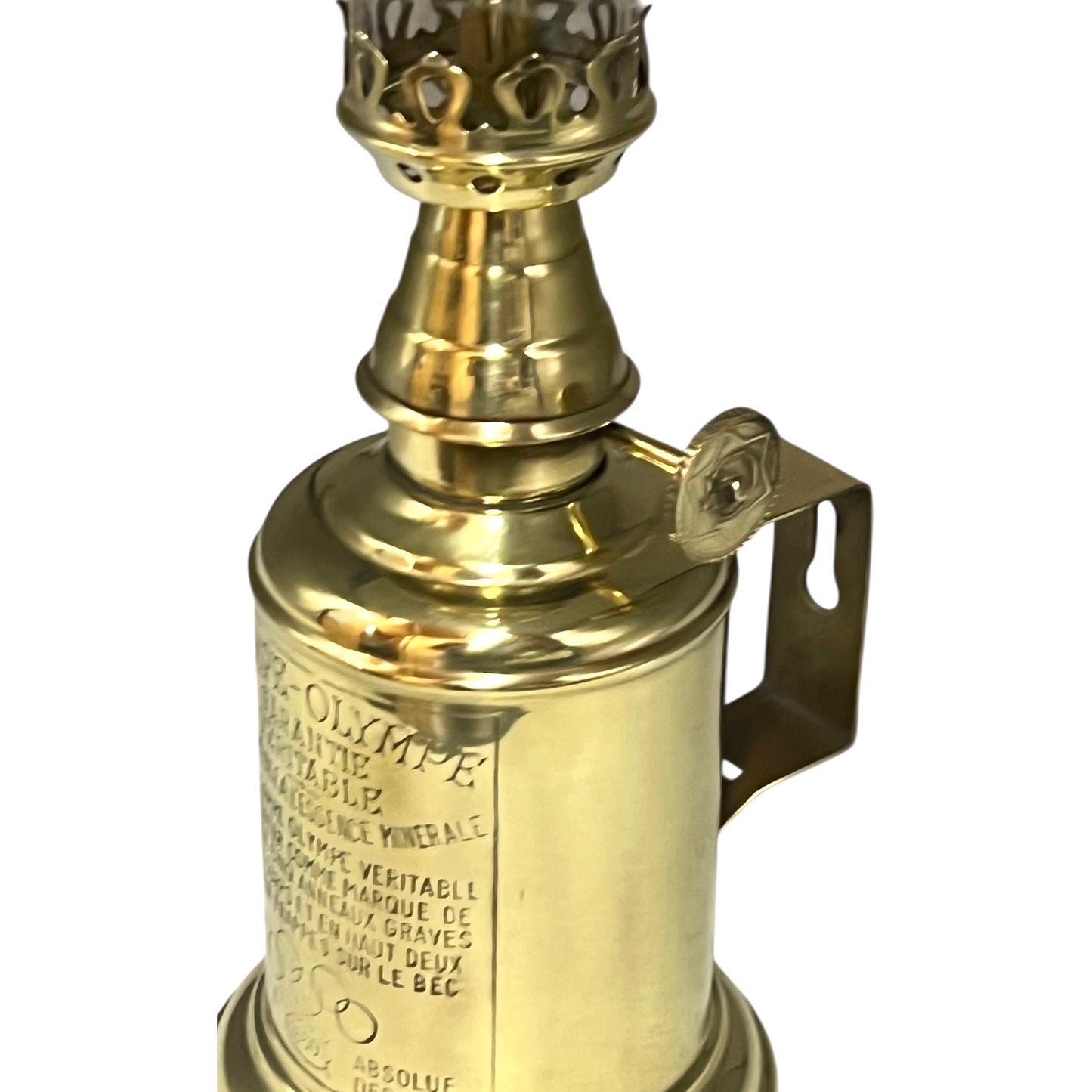 Brass lamp with intricate design on a white background