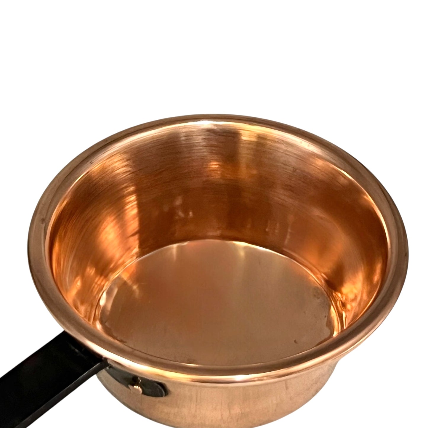 Copper saucepan with black handle on a white background