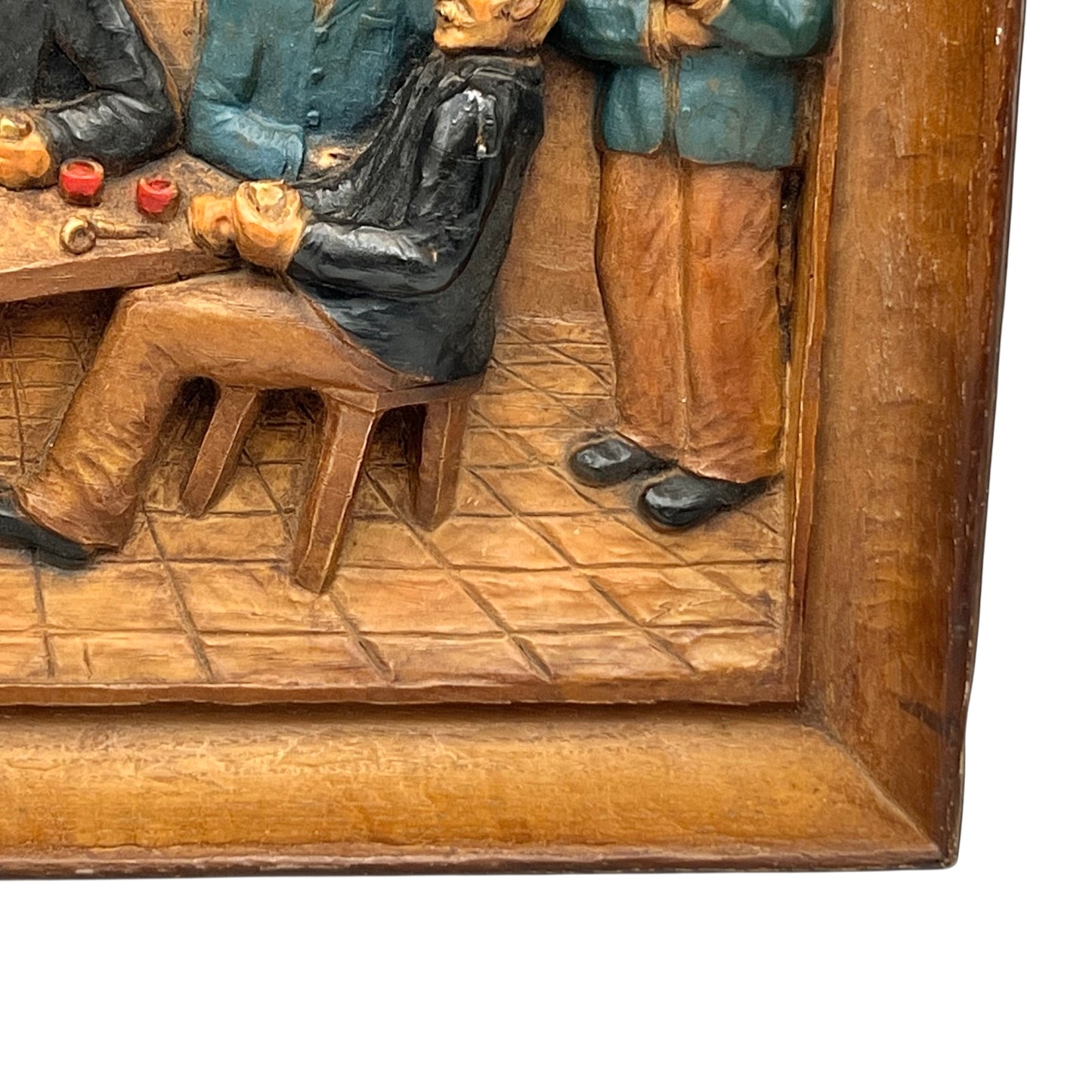 close up of wooden relief sculpture in an arts and crafts style on a white background