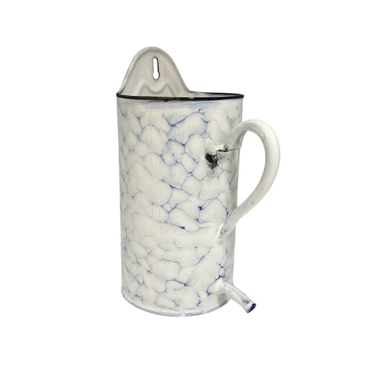 A vintage-style enamel pitcher planter with a white body, blue crackle pattern, and a white handle, shown on a plain white background.