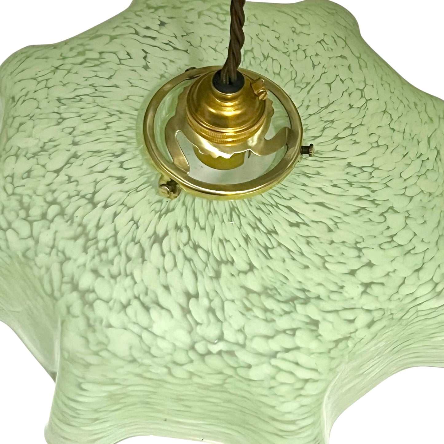 Vintage-style green lamp with textured shade and brass fitting on a white background