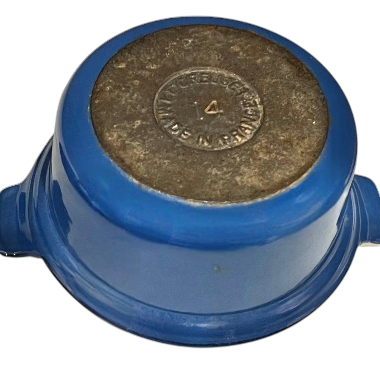 base of blue Le Creuset cocotte