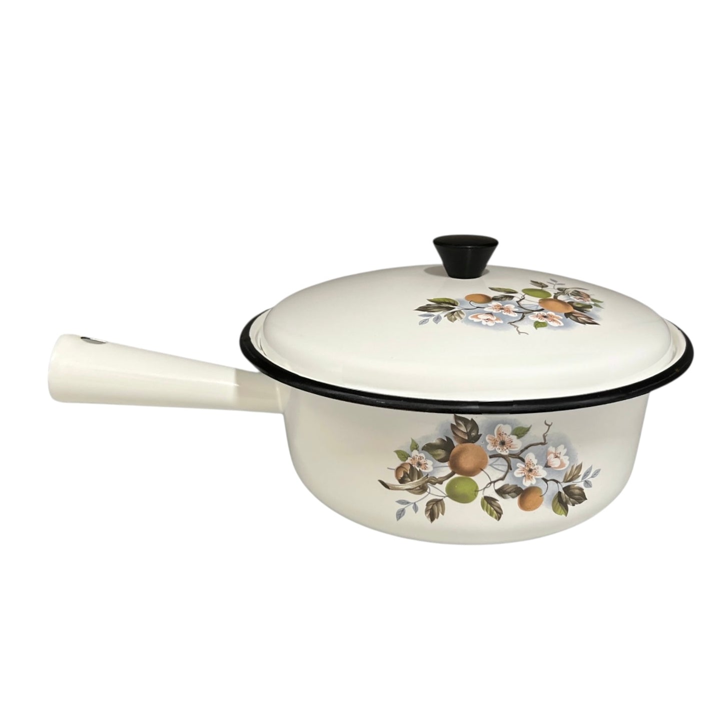 White enamel saucepan and lid with floral design on a white background
