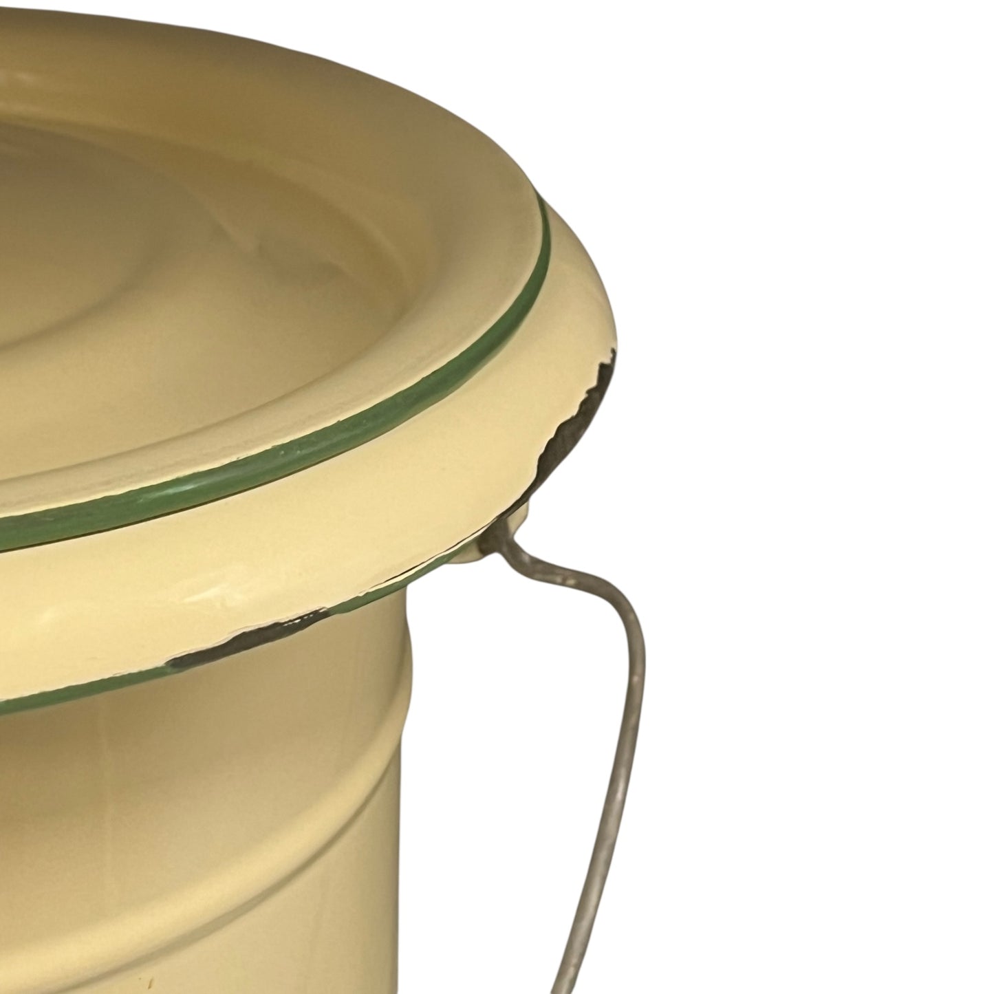 Close up of French vintage cream and green enamel bucket with a lid and handle on a white background