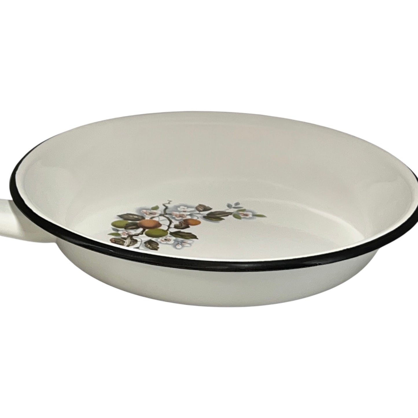 White frying pan with floral design on a white background