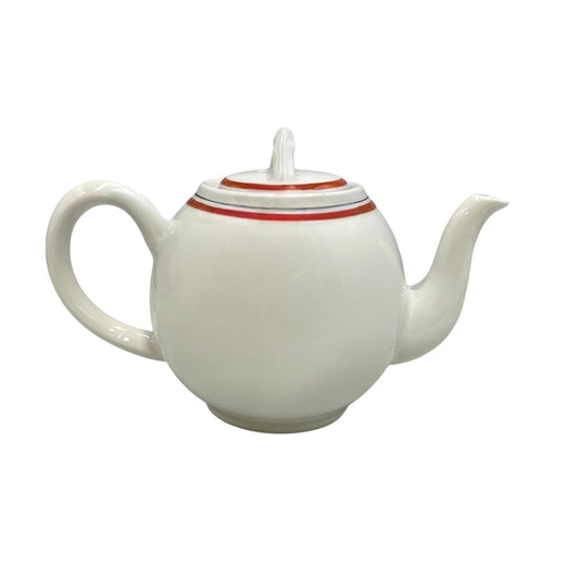 White teapot with a red stripe on the lid against a white background