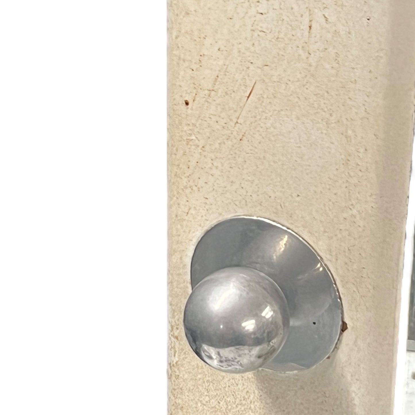 Close-up of a bathroom cabinet door handle