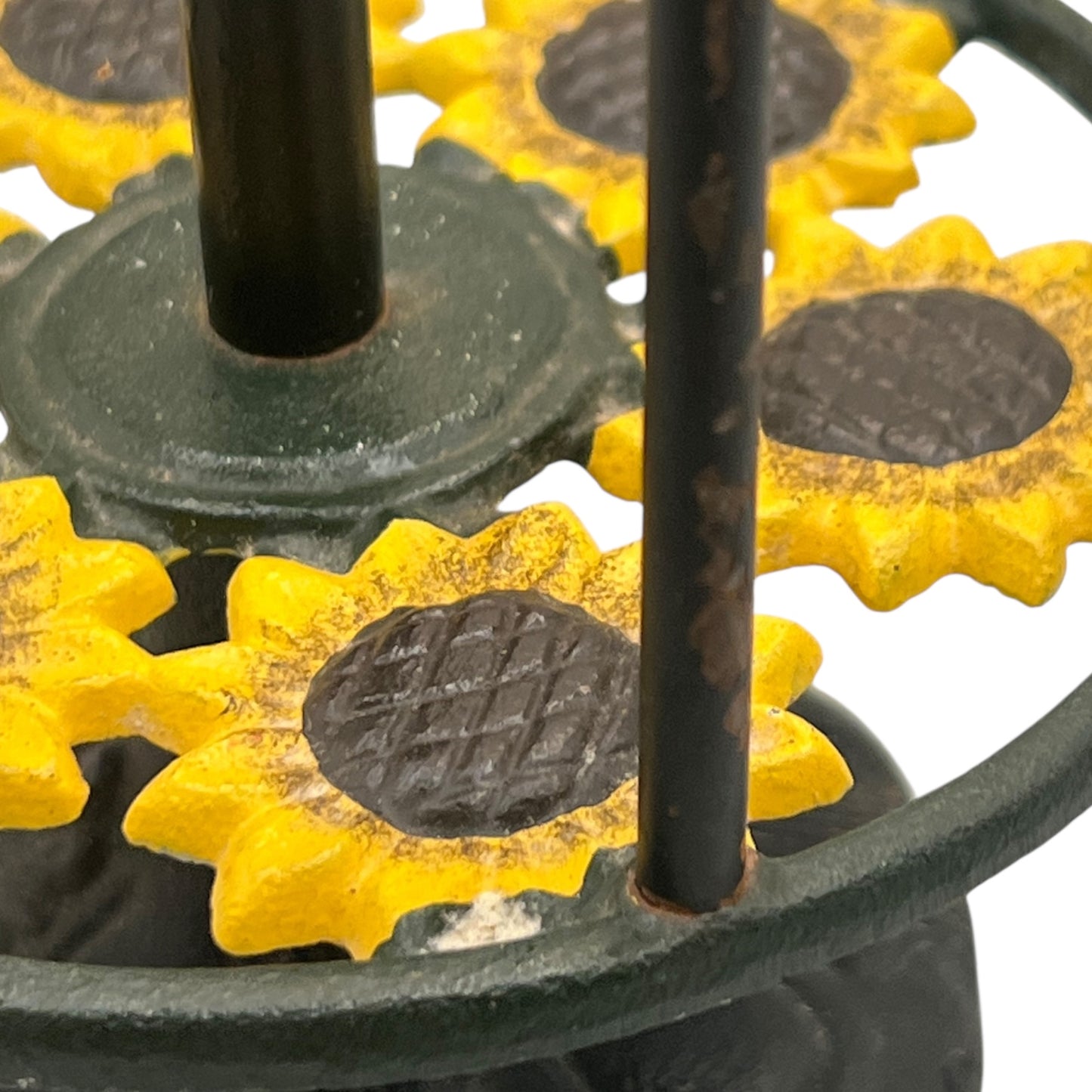 Close-up of a sunflower decoration on a kitchen paper towel stand on a white background
