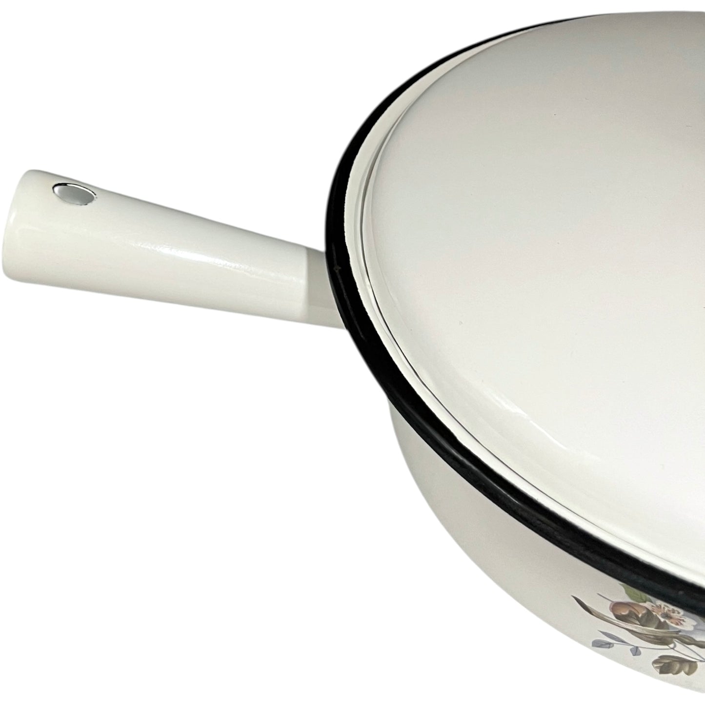 White enamel saucepan and lid with floral design on a white background