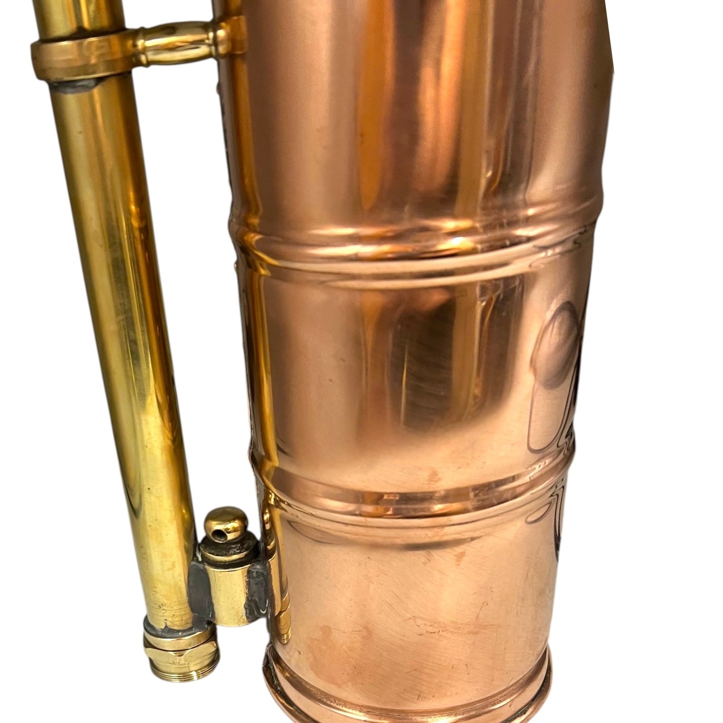 Copper and brass lamp with a white background