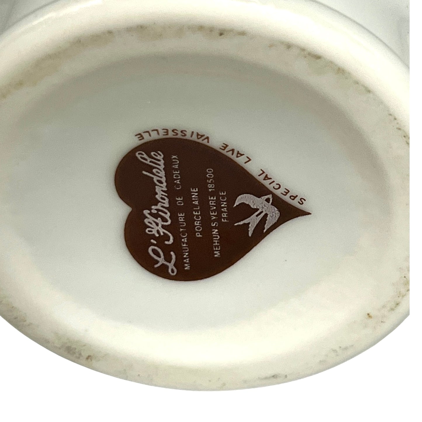 Ceramic product with a heart-shaped Hirondelle logo and text on a white background