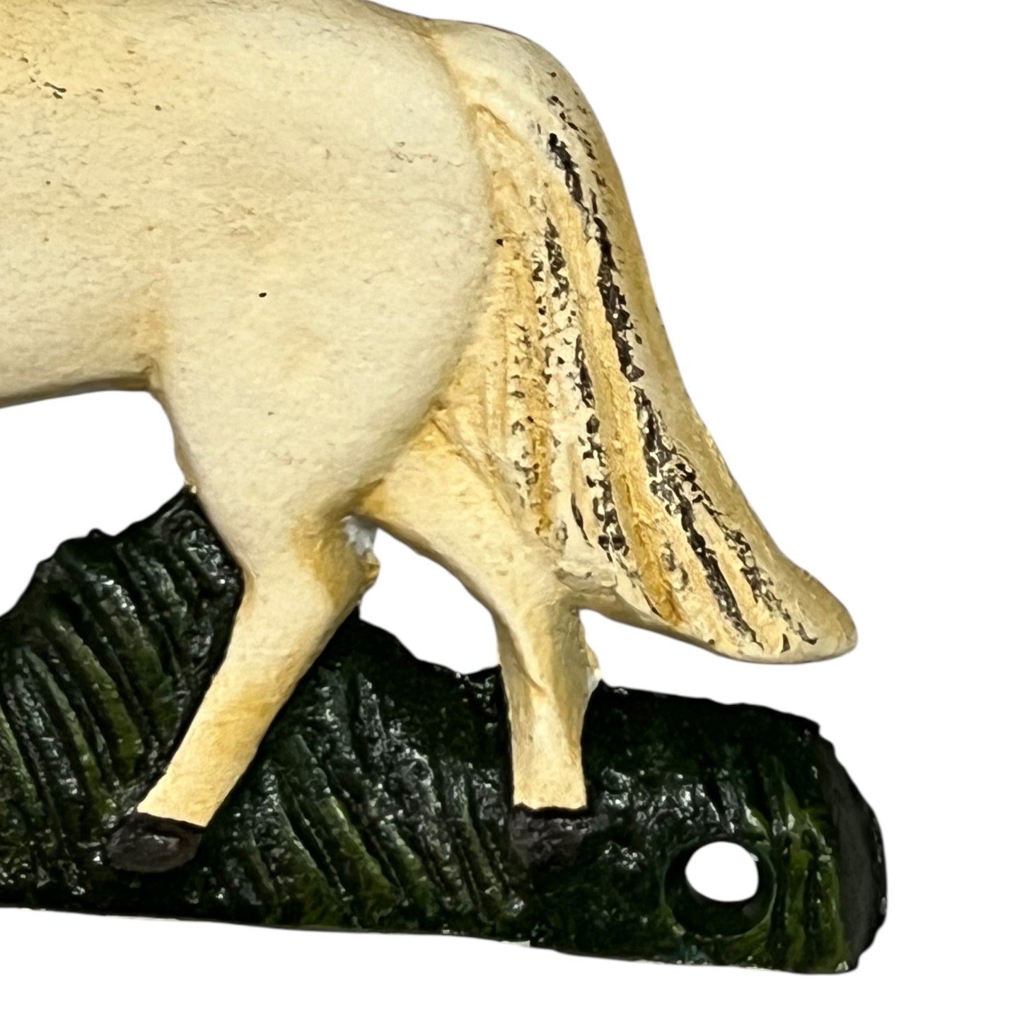 Close up of white horse toilet paper holder against a white background