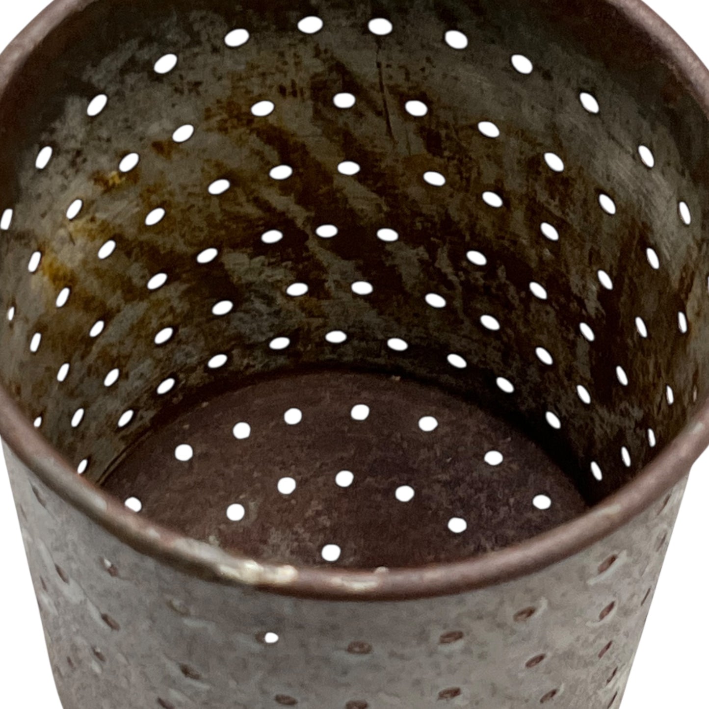 Close-up of a vintage French fruit press with an enamel pot on a white background