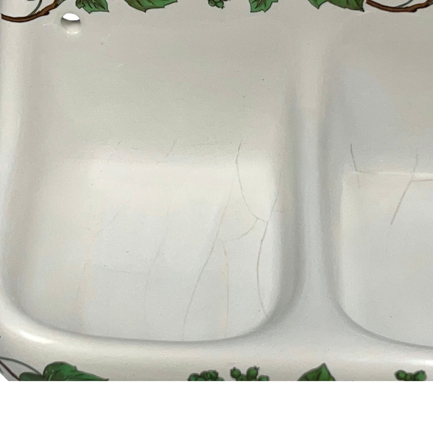 White porcelain double soap dish with green leaf patterns on a white background for sale