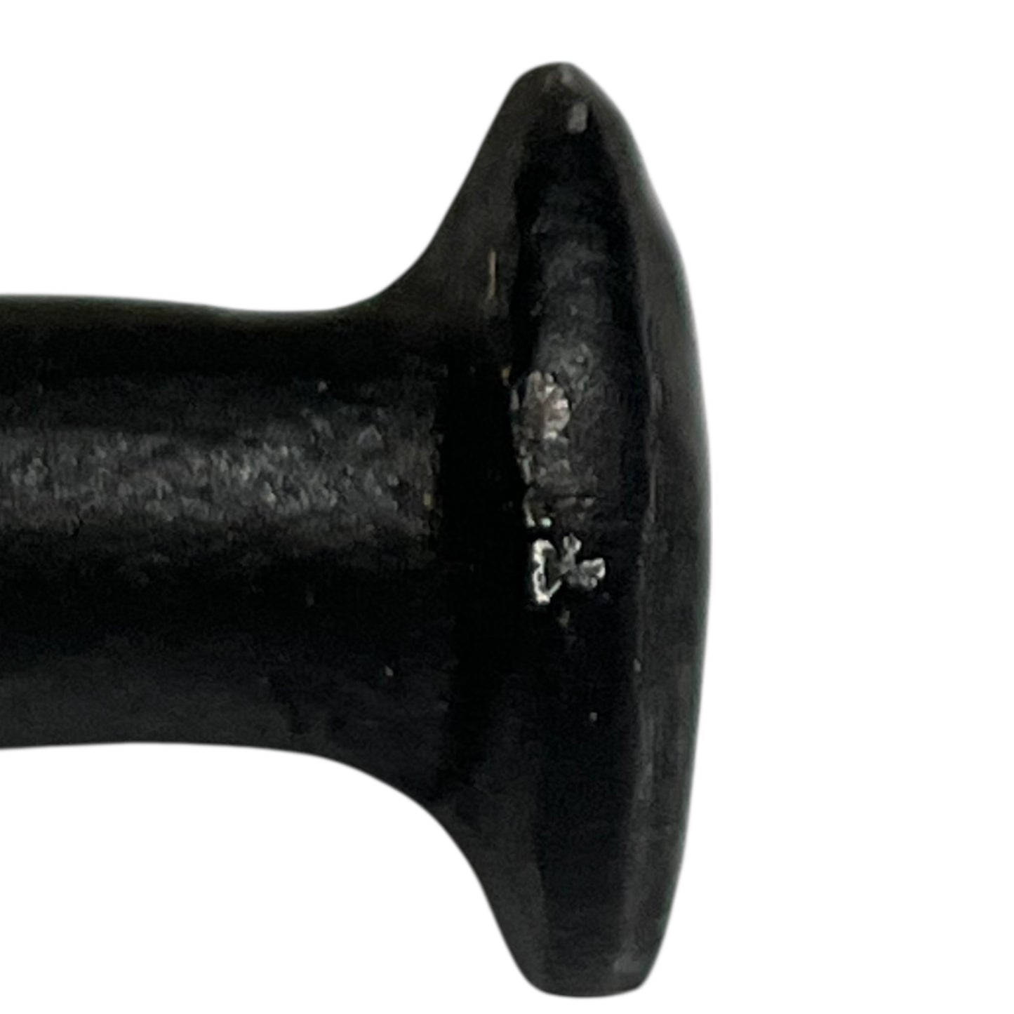 Close up of cow toilet paper holder with black and white pattern on a white background