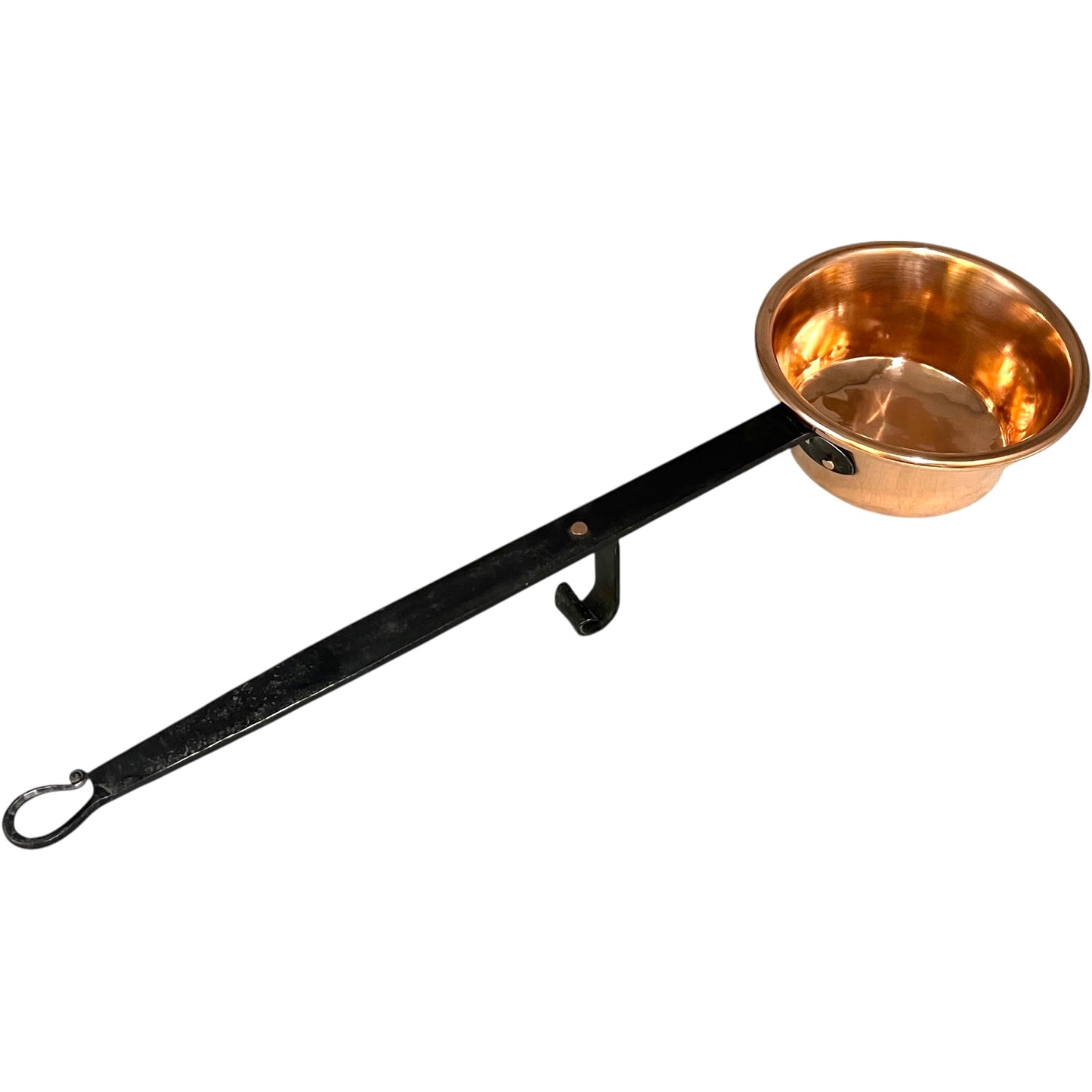 Copper ladle with a black handle on a white background