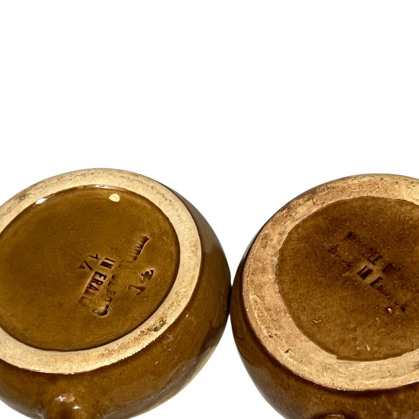 6 hole brown ceramic escargot plates reverse side