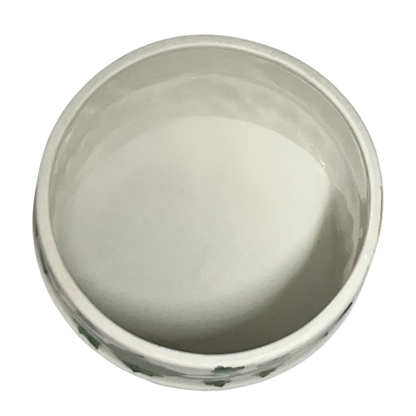 inside of small trinket pot on a white background