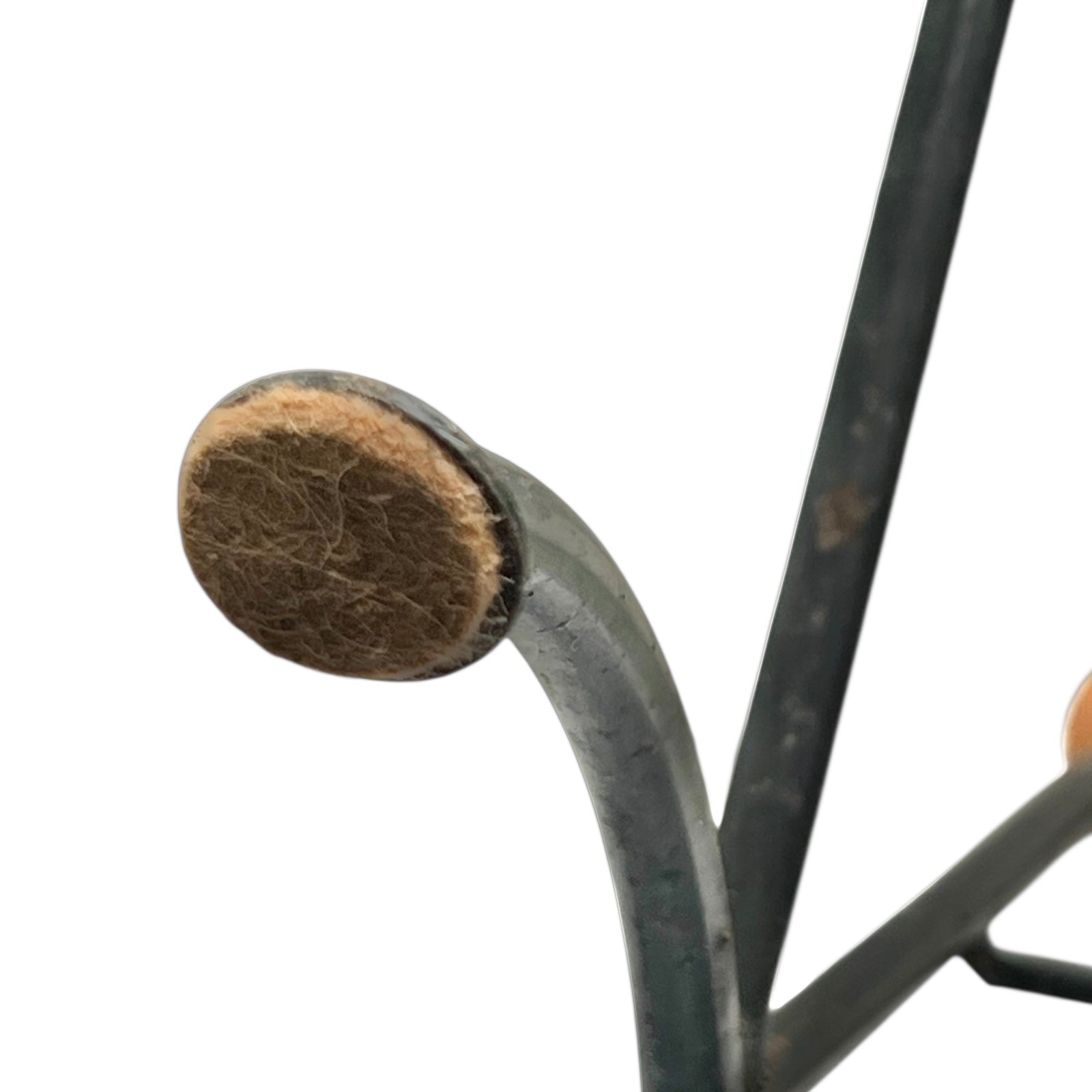 Close-up of a black metal stand on a white background