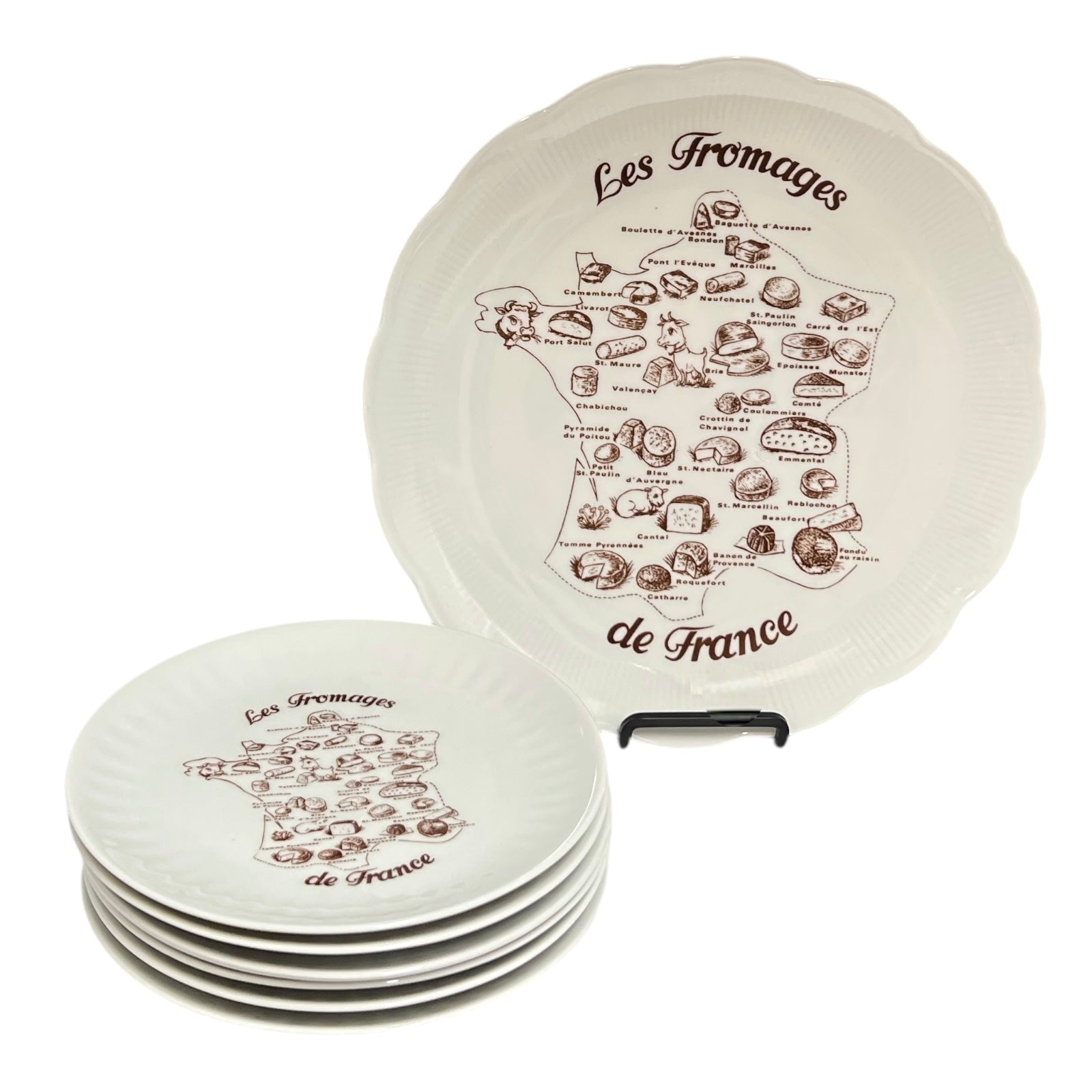 Set of four round ceramic plates with 'Les Fromages de France' design on a white background
