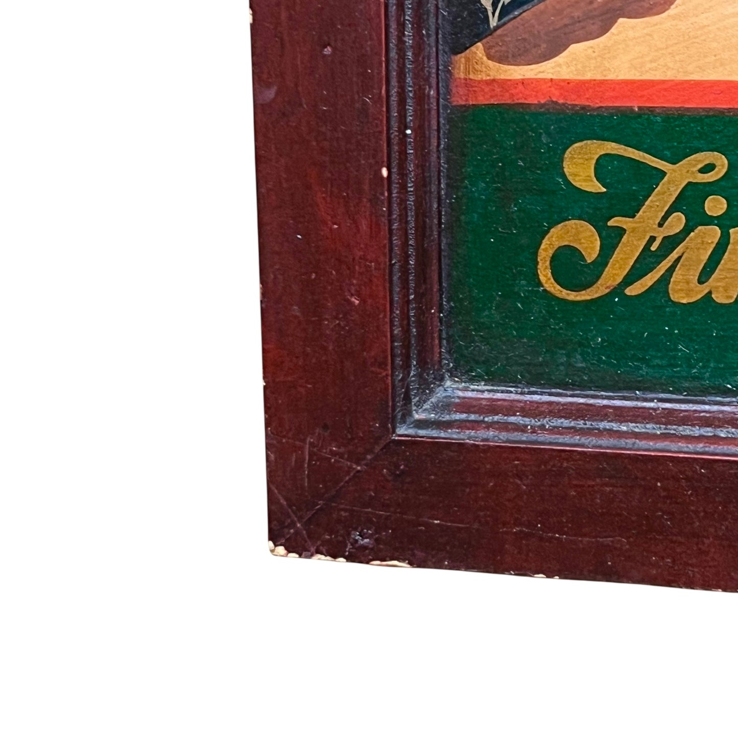 Close-up of a wooden frame with a green interior and gold lettering.
