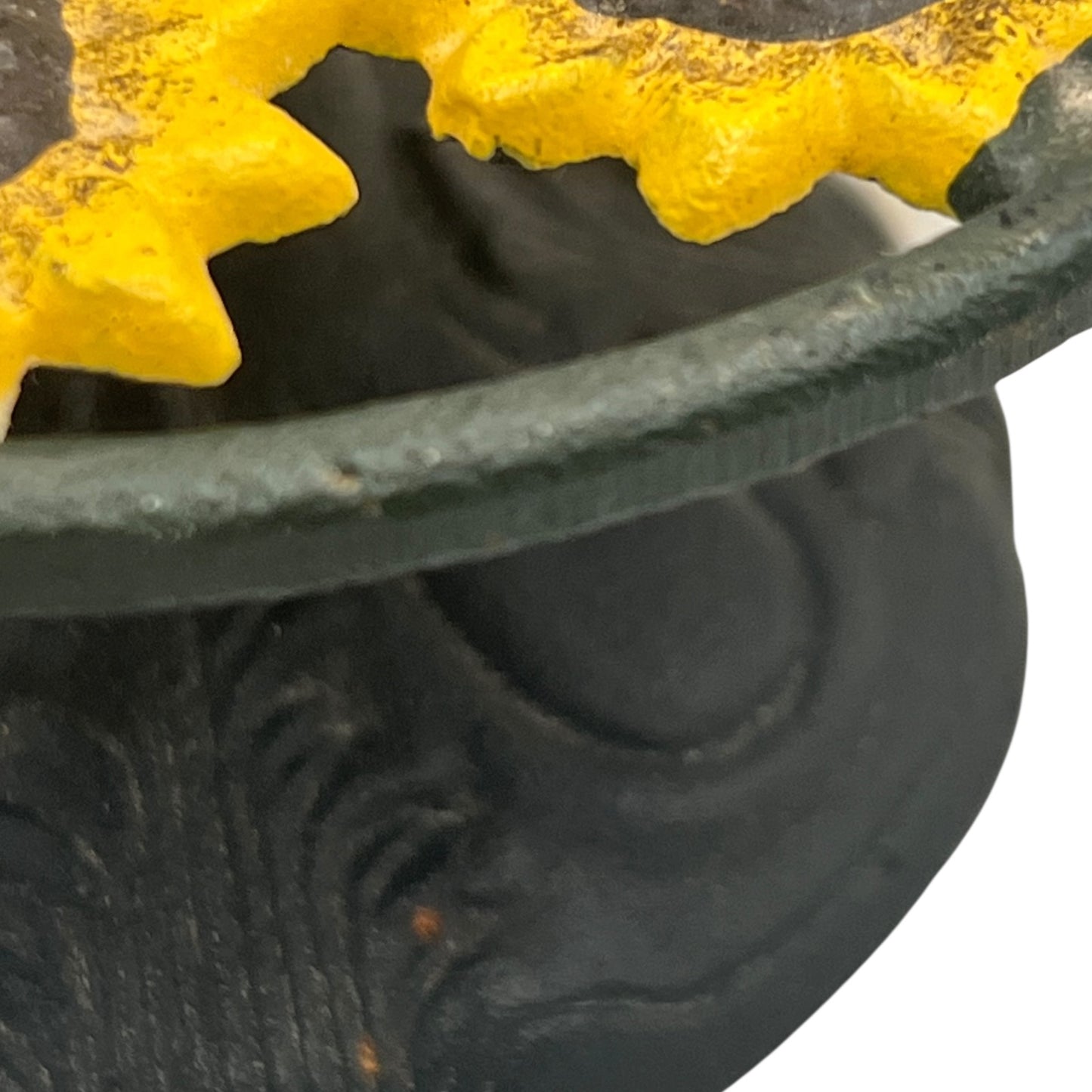 Close-up of a sunflower decoration on a kitchen paper towel stand on a white background