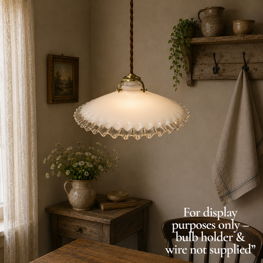 French vintage milk glass opaline lampshade with a frilled edge and brass collar, set against a rustic kitchen background, perfect for adding charm to a vintage-style period home.